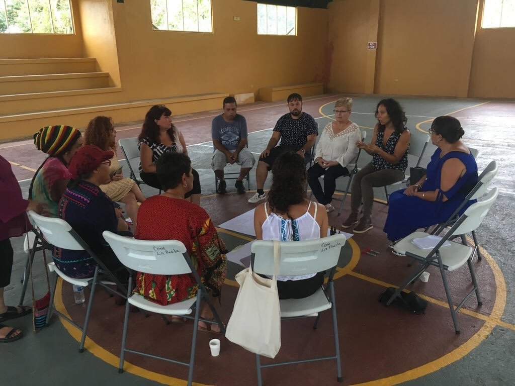 Group of people in Puerto Rico sharing stories about impacts of Hurricane Maria