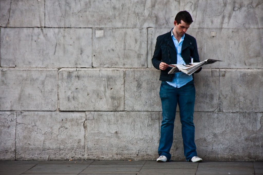 Man reading newspaper