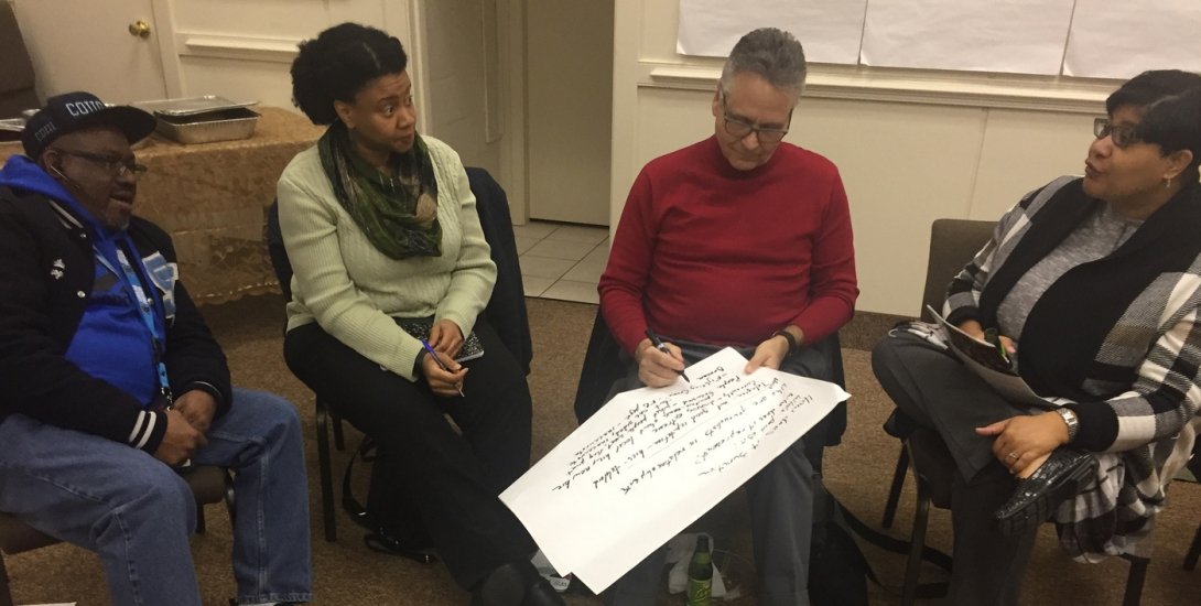 Four people in Rocky Mount brainstorming about the future of local news