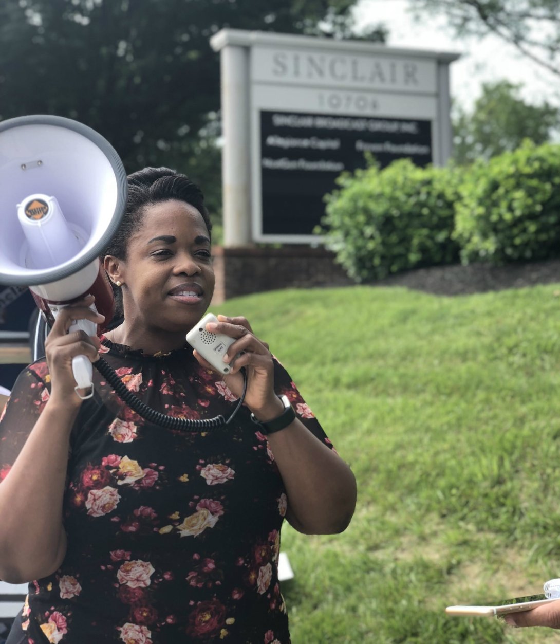 A woman speaking into a megaphone