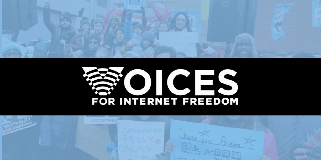 A Net Neutrality protest with "Voices for Internet Freedom" overlaid on top of the image