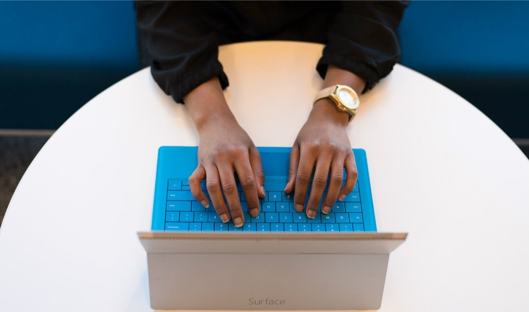 Person typing on laptop